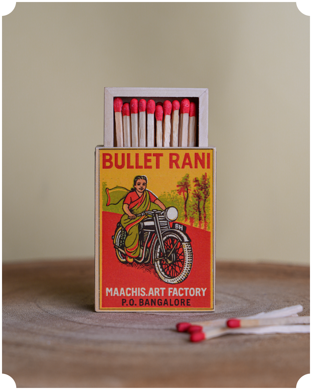 Matchbox with 'Bullet Rani' featuring a woman on a motorcycle 