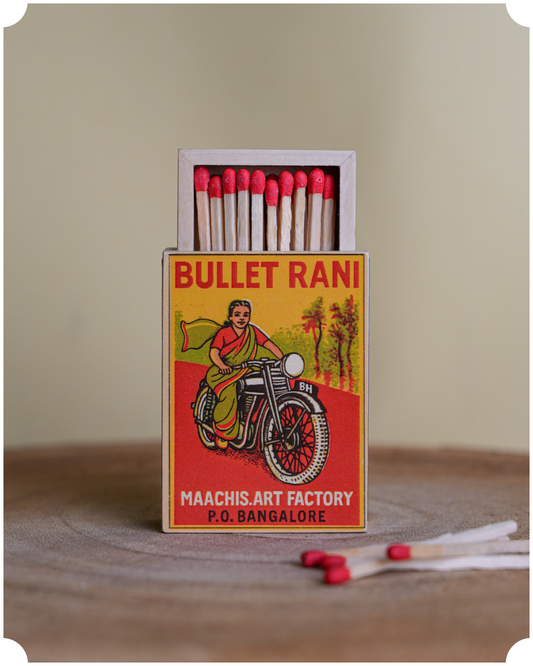 Matchbox with 'Bullet Rani' featuring a woman on a motorcycle 